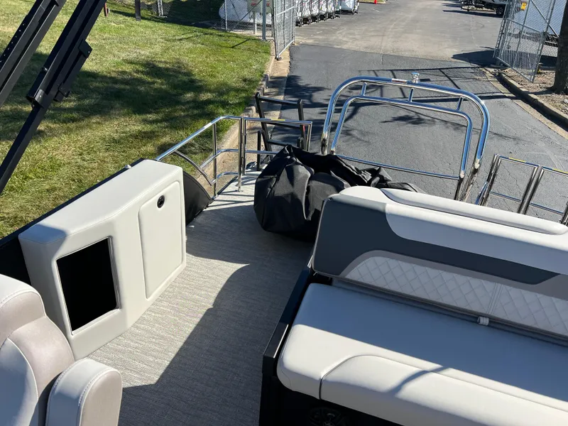 Slide: The Image of 2025 Godfrey SWEETWATER 2286 SFL pontoon boat interior with seating and railing. - 15