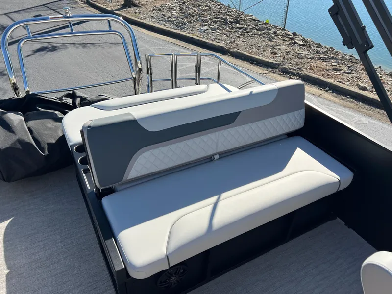 Slide: The Image of 2025 Godfrey SWEETWATER 2286 SFL boat seating area with sleek design and waterfront view. - 16