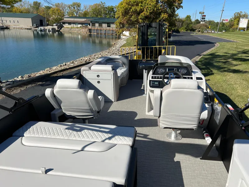 Slide: The Image of 2025 Godfrey SWEETWATER 2286 SFL pontoon boat interior with seating and steering console. - 20