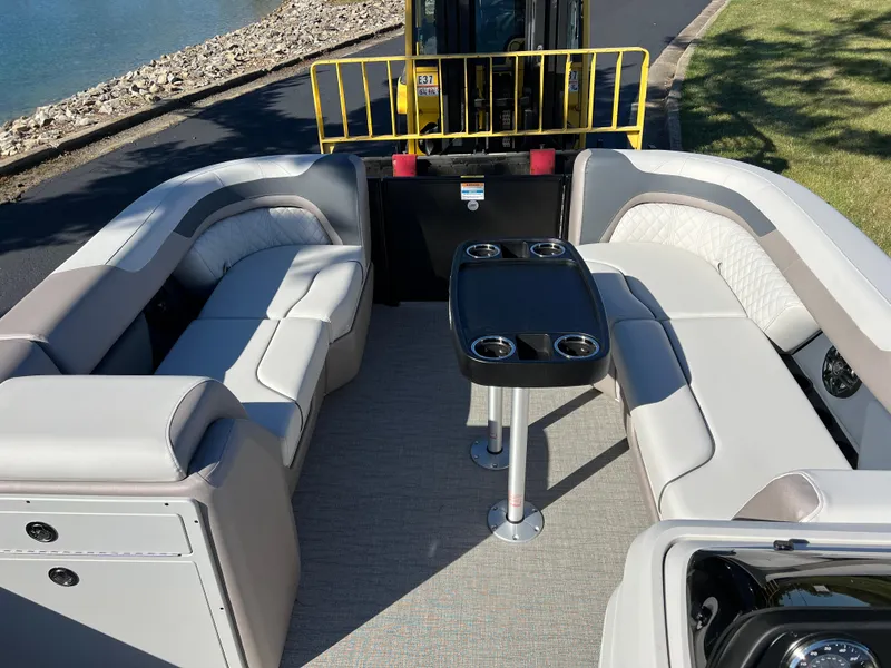 Slide: The Image of 2025 Godfrey SWEETWATER 2286 SFL pontoon boat interior with seating and table. - 26