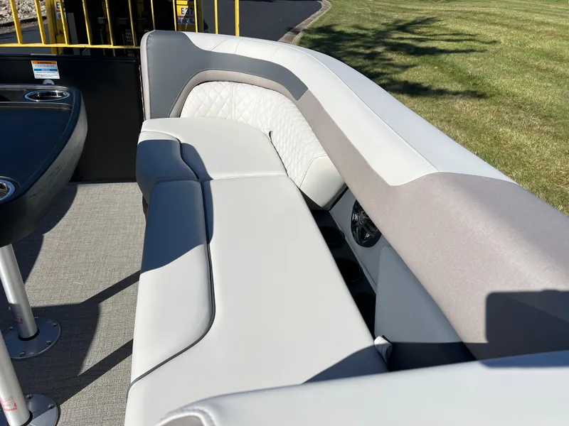 Slide: The Image of 2025 Godfrey SWEETWATER 2286 SFL boat interior with plush seating and modern design. - 27