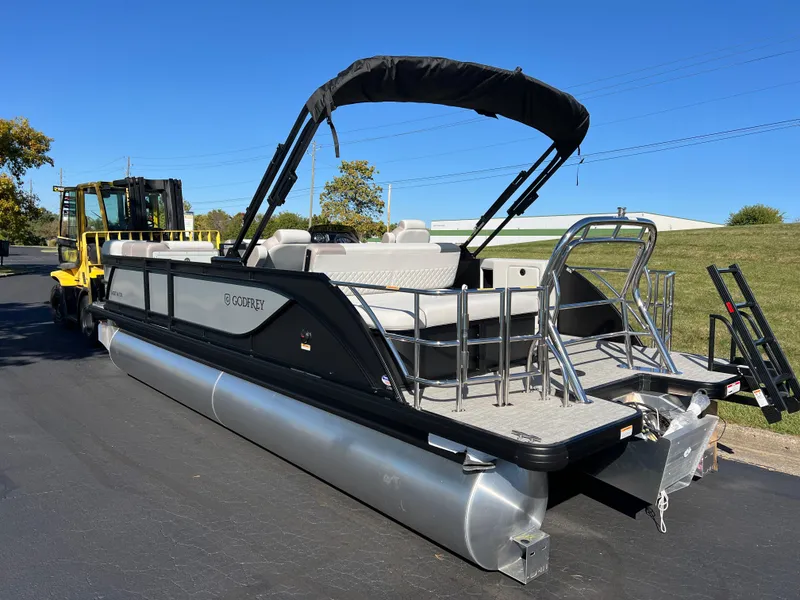 Slide: The Image of 2025 Godfrey SWEETWATER 2286 SFL pontoon boat with canopy on a sunny day. - 5