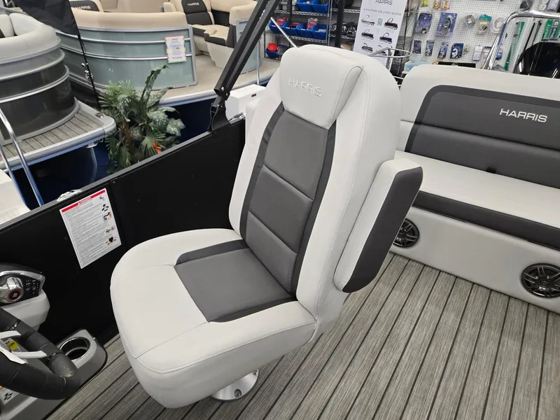 Slide: The Image of 2024 Harris Cruiser 230 boat interior with gray seating and modern design. - 12