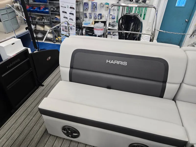 Slide: The Image of 2024 Harris Cruiser 230 boat interior with gray seating and modern design. - 18