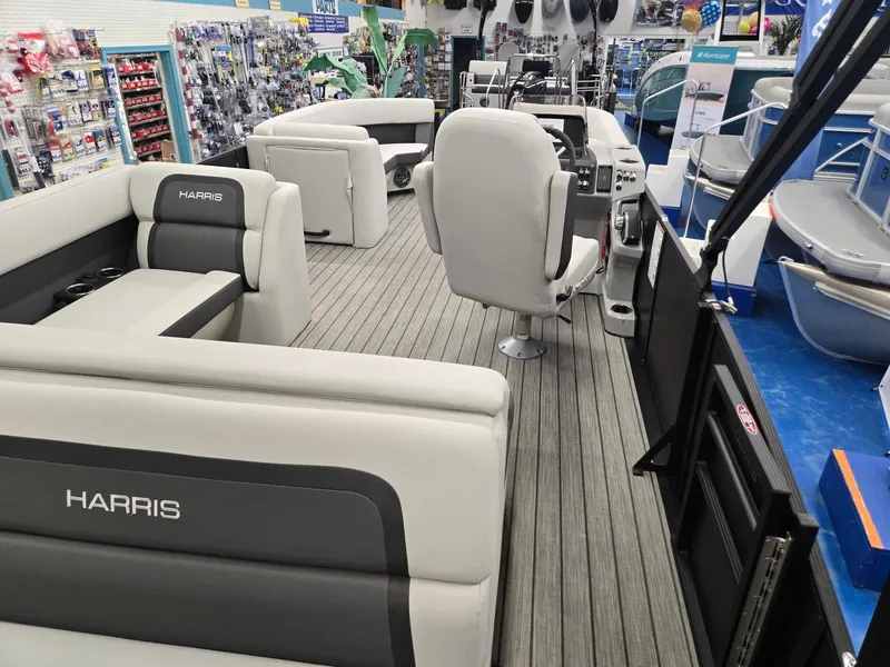 Slide: The Image of 2024 Harris Cruiser 230 pontoon boat interior with plush seating and modern design. - 21