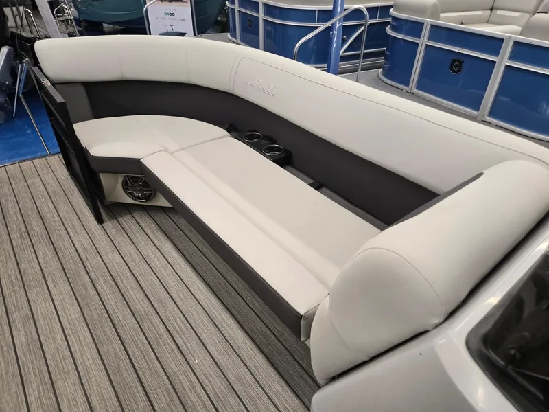 Slide: The Image of 2024 Harris Cruiser 230 boat interior with sleek seating and cup holders. - 26