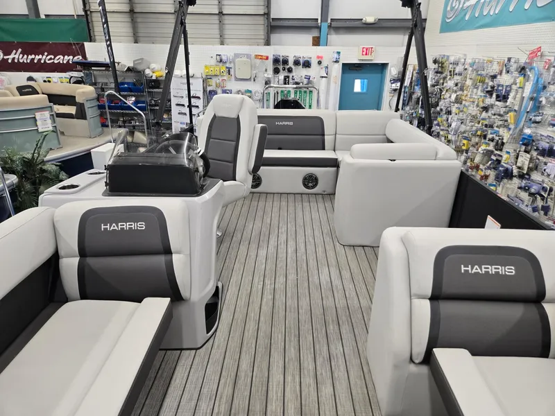 Slide: The Image of 2024 Harris Cruiser 230 pontoon boat interior with gray seating and modern design. - 7