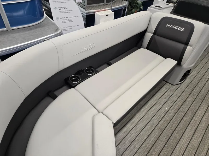 Slide: The Image of 2024 Harris Cruiser 230 boat interior with gray seating and cup holders. - 8