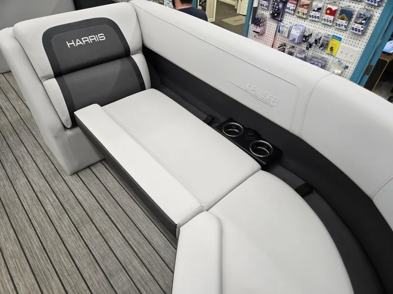 Slide: The Image of 2024 Harris Cruiser 230 boat interior with gray seating and cup holders. - 9