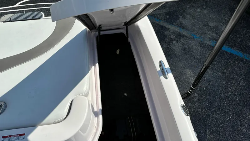 Slide: The Image of Open storage compartment in 2005 Correct Craft SV211 Nautique Air boat. - 10