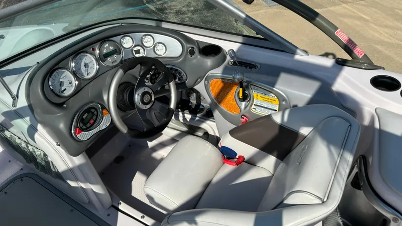 Slide: The Image of 2005 Correct Craft SV211 Nautique Air boat interior with dashboard and steering wheel. - 12