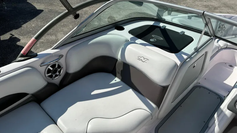 Slide: The Image of 2005 Correct Craft SV211 Nautique Air interior with white and gray seating. - 13