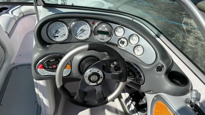 Slide: The Image of 2005 Correct Craft SV211 Nautique Air dashboard with gauges and steering wheel. - 17