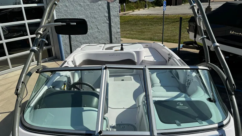 Slide: The Image of 2005 Correct Craft SV211 Nautique Air boat interior with windshield and seating. - 20