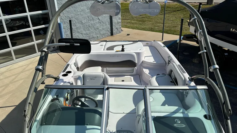Slide: The Image of 2005 Correct Craft SV211 Nautique Air boat interior with seating and wakeboard tower. - 21