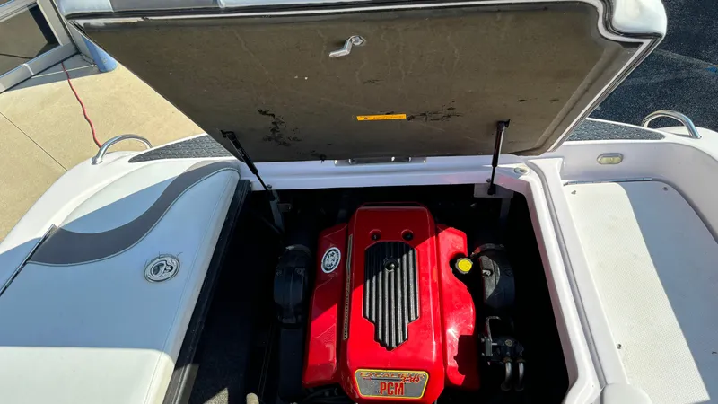 Slide: The Image of 2005 Correct Craft SV211 Nautique Air engine compartment with red PCM engine. - 24