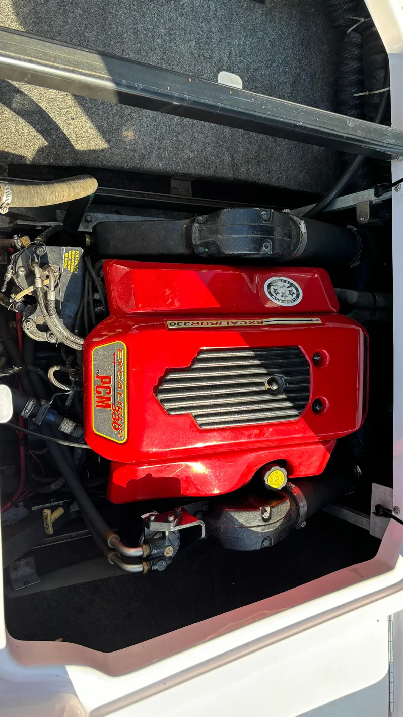 Slide: The Image of 2005 Correct Craft SV211 Nautique Air engine with red cover. - 28