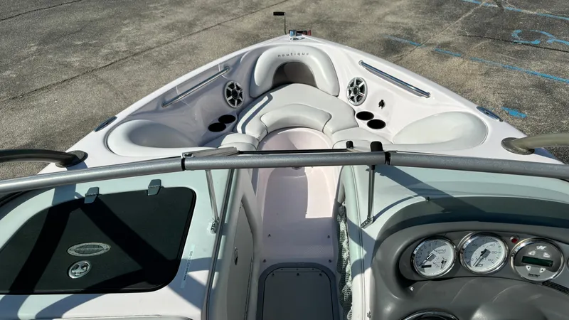 Slide: The Image of 2005 Correct Craft SV211 Nautique Air boat interior with seating and dashboard. - 8