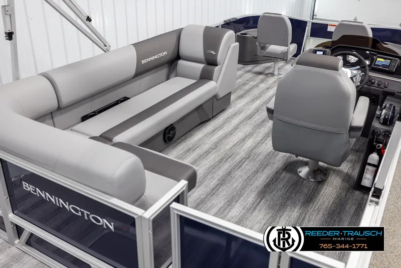 Slide: The Image of 2025 Bennington 188 SSSE pontoon boat interior with gray seating and modern dashboard. - 12