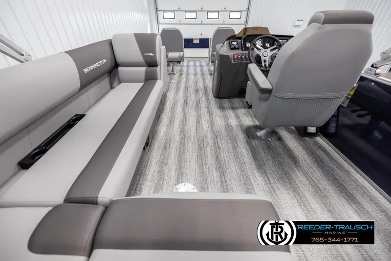 Slide: The Image of 2025 Bennington 188 SSSE boat interior with gray seating and modern dashboard. - 16