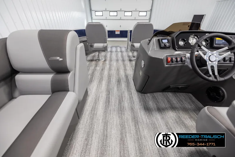 Slide: The Image of 2025 Bennington 188 SSSE boat interior with modern seating and sleek dashboard design. - 17