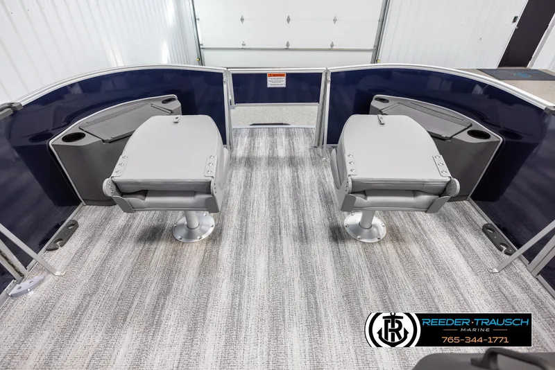 Slide: The Image of 2025 Bennington 188 SSSE boat interior with two swivel seats and cup holders. - 19