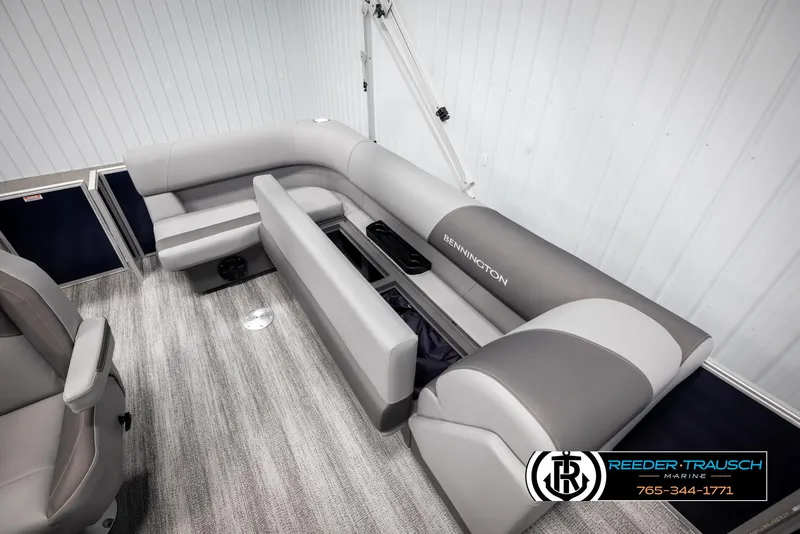 Slide: The Image of 2025 Bennington 188 SSSE boat interior with gray seating and storage compartments. - 22