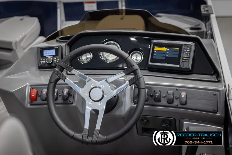 Slide: The Image of Steering console of 2025 Bennington 188 SSSE boat with modern controls and displays. - 24