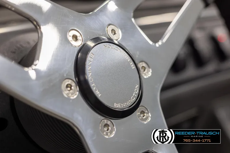 Slide: The Image of Close-up of 2025 Bennington 188 SSSE steering wheel with logo detail. - 26