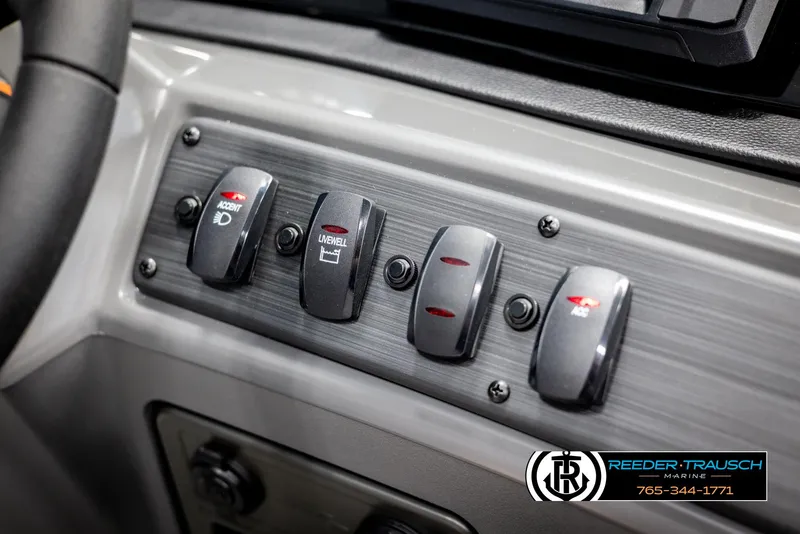 Slide: The Image of Dashboard controls of 2025 Bennington 188 SSSE boat with labeled switches. - 31
