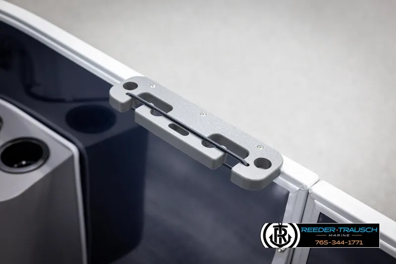 Slide: The Image of 2025 Bennington 188 SSSE boat detail with cup holders and Reeder-Trausch Marine logo. - 35