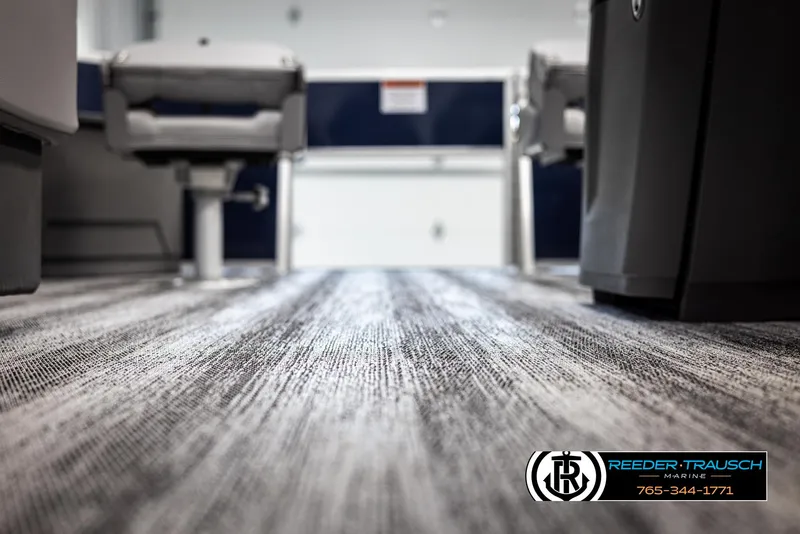 Slide: The Image of Interior view of 2025 Bennington 188 SSSE boat, featuring modern flooring and seating. - 39