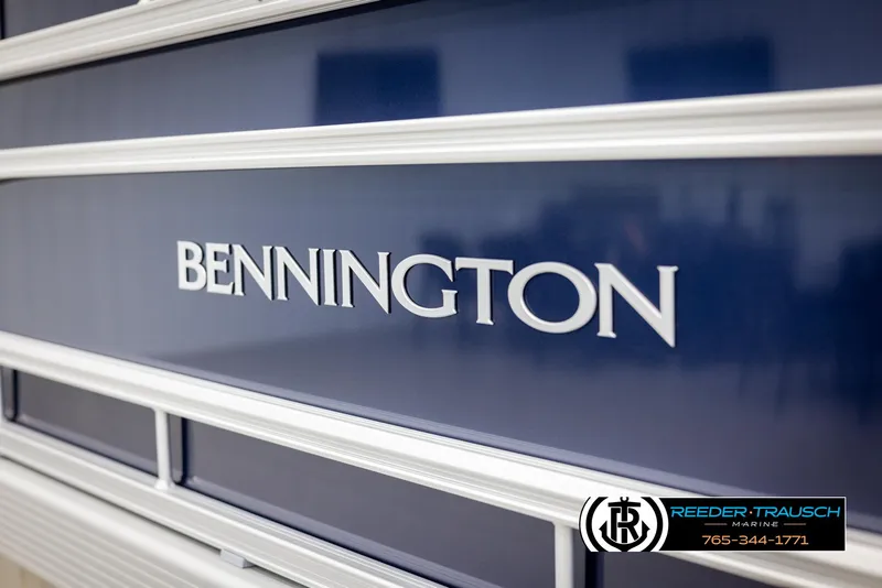 Slide: The Image of 2025 Bennington 188 SSSE boat exterior with logo, blue and white design. - 42