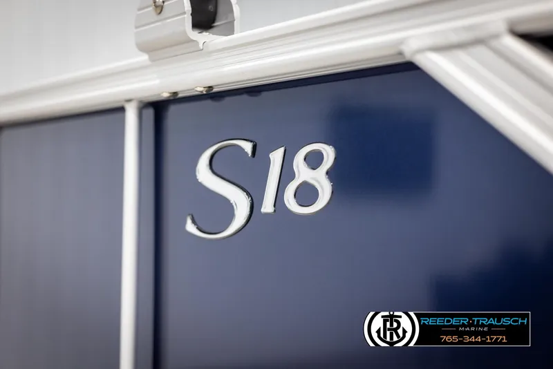 Slide: The Image of Close-up of 2025 Bennington 188 SSSE boat with 'S18' marking, Reeder-Trausch Marine logo visible. - 43