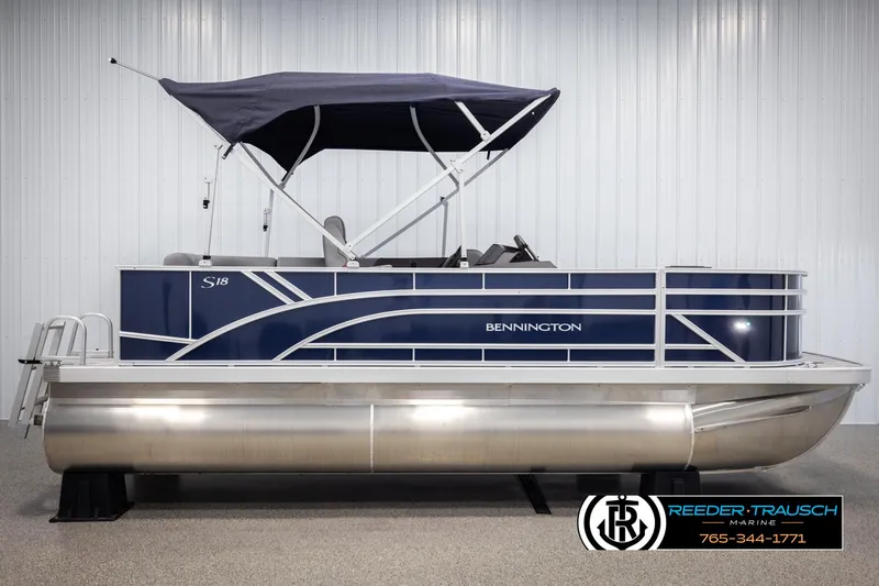 Slide: The Image of 2025 Bennington 188 SSSE pontoon boat with blue exterior and canopy, displayed indoors. - 5