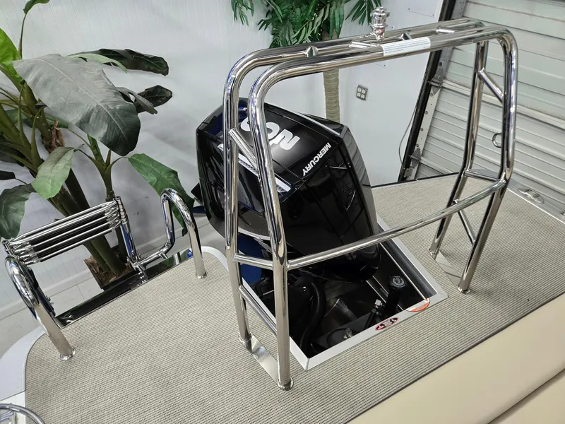 Slide: The Image of 2025 Harris Cruiser 210 boat with Honda engine, featuring stainless steel railings and ladder. - 16