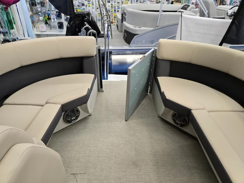 Slide: The Image of 2025 Harris Cruiser 210 interior with beige seating and modern design. - 23