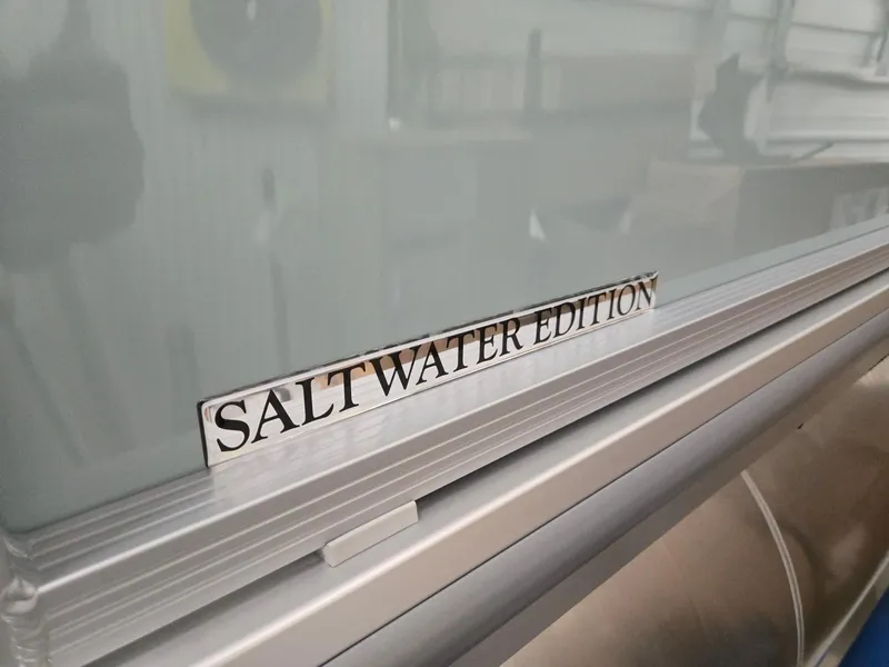 Slide: The Image of 2025 Harris Cruiser 210 Saltwater Edition label on boat exterior. - 27