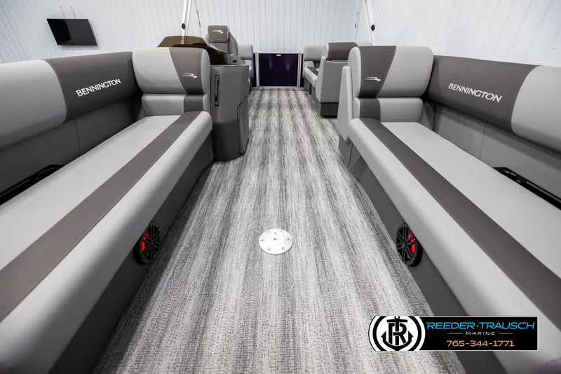 Slide: The Image of 2025 Bennington 21 SSRSE boat interior with gray seating and carpeted flooring. - 13