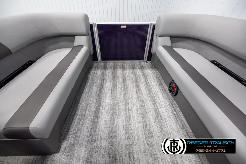 Slide: The Image of Interior of 2025 Bennington 21 SSRSE pontoon boat with gray seating and carpet flooring. - 15