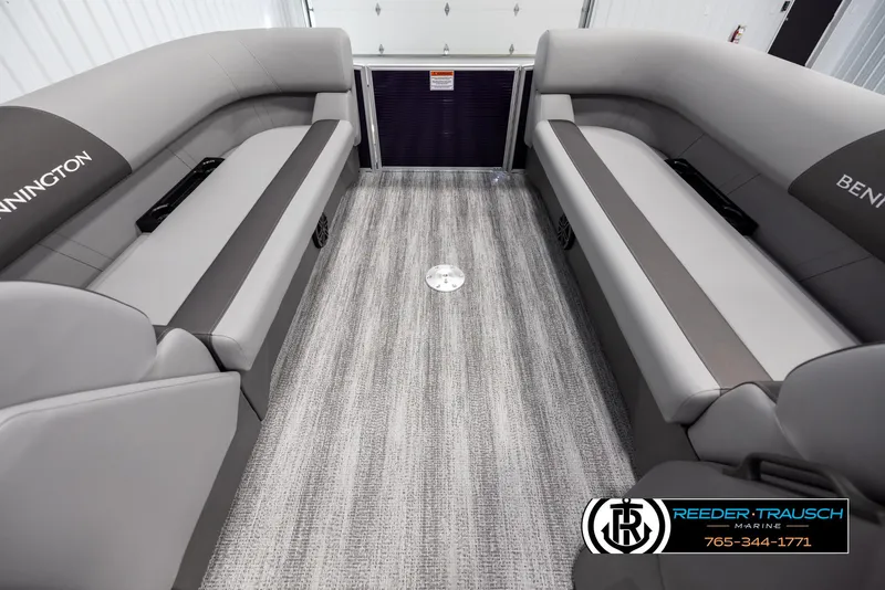 Slide: The Image of 2025 Bennington 21 SSRSE pontoon boat interior with gray seating and carpet flooring. - 18