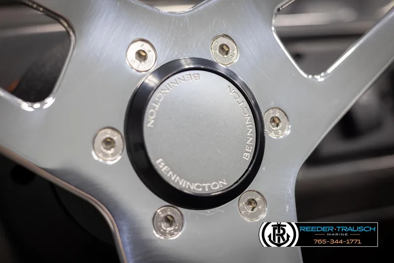 Slide: The Image of Close-up of 2025 Bennington 21 SSRSE steering wheel with logo and metallic finish. - 26