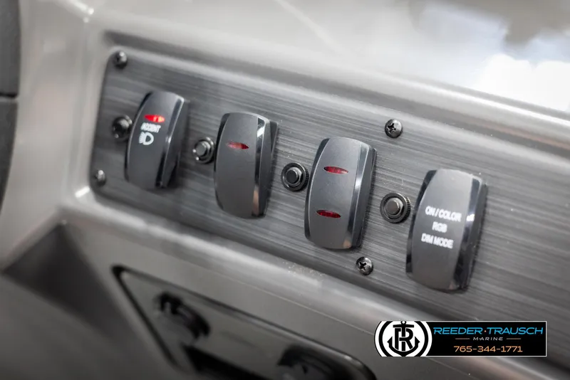 Slide: The Image of Control panel of 2025 Bennington 21 SSRSE boat with switches and branding. - 31