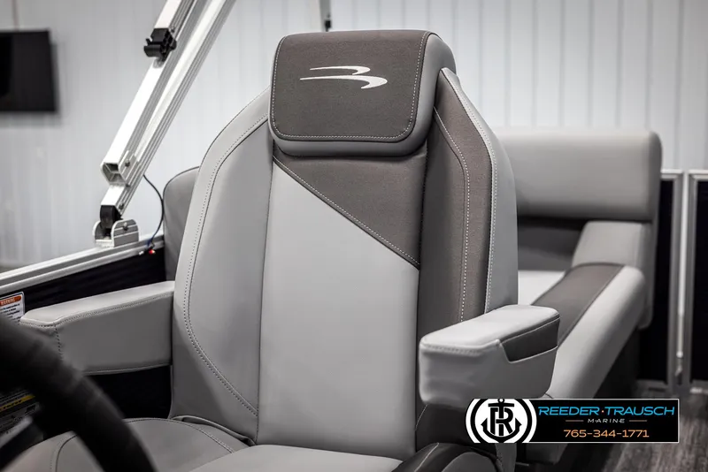 Slide: The Image of 2025 Bennington 21 SSRSE boat seat with sleek gray upholstery and armrest. - 32