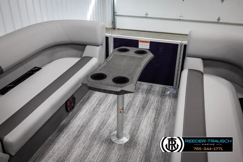 Slide: The Image of Interior of 2025 Bennington 21 SSRSE pontoon boat with seating and table. - 38