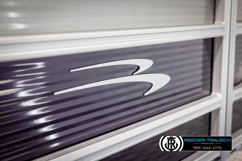 Slide: The Image of 2025 Bennington 21 SSRSE boat detail with logo, Reeder-Trausch Marine branding. - 40