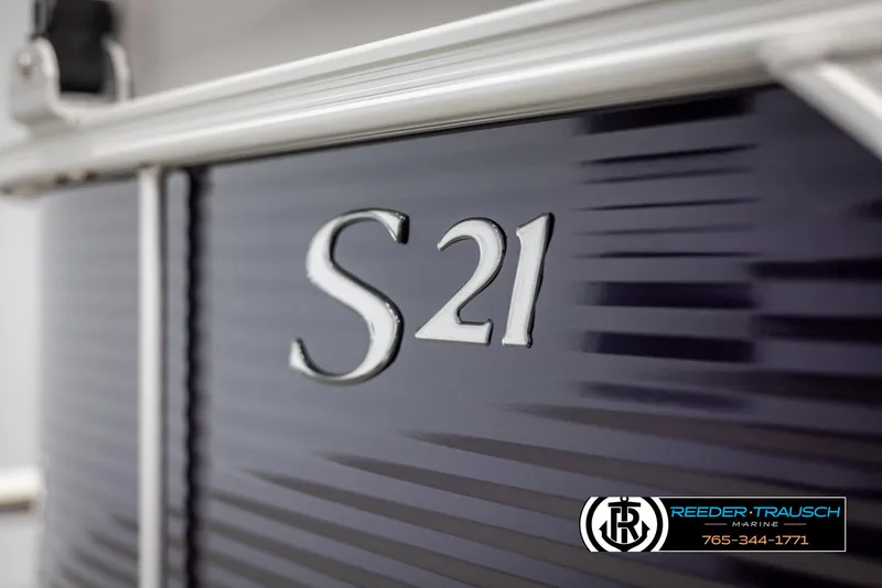 Slide: The Image of 2025 Bennington 21 SSRSE boat with "S21" emblem, Reeder-Trausch Marine logo visible. - 43