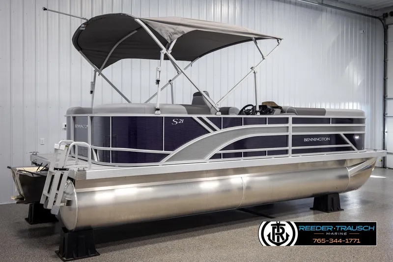 Slide: The Image of 2025 Bennington 21 SSRSE pontoon boat with canopy in a showroom. - 6