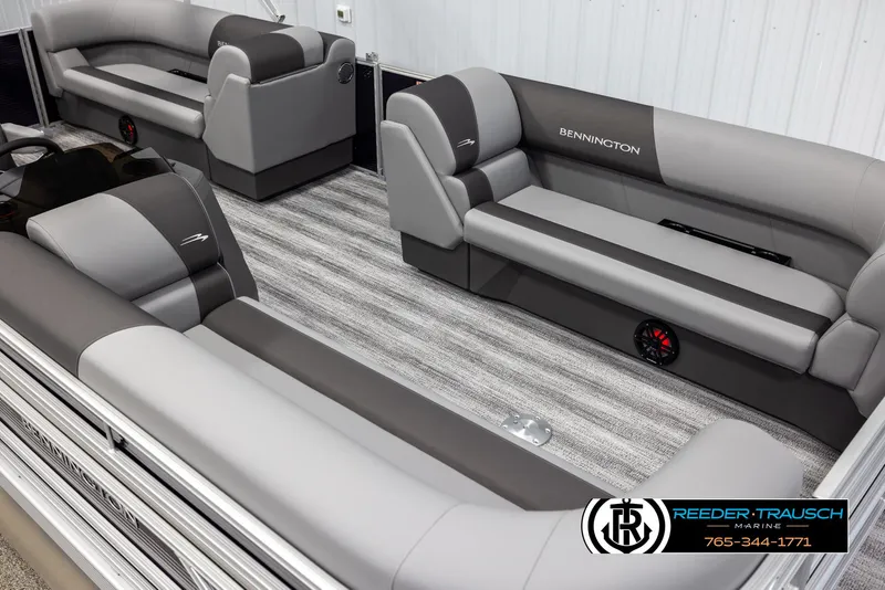 Slide: The Image of 2025 Bennington 21 SSRSE pontoon boat interior with gray seating and striped flooring. - 9