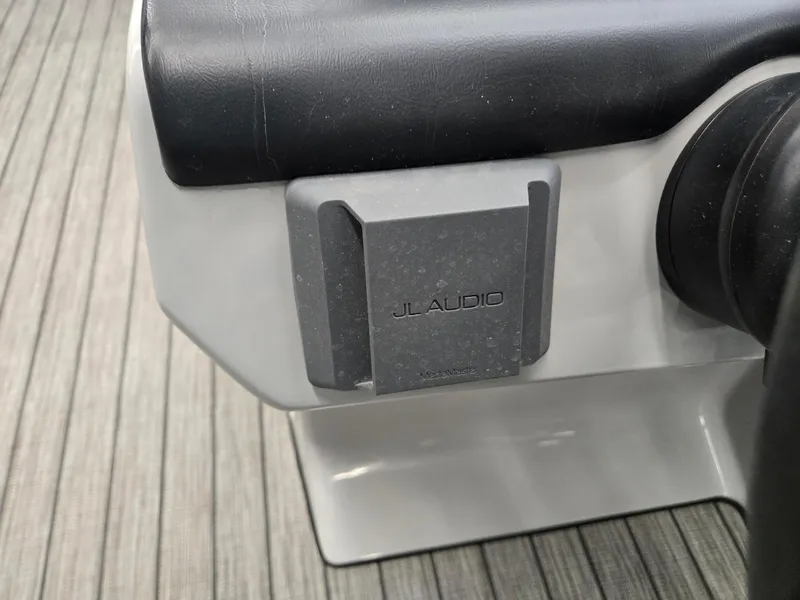 Slide: The Image of JL Audio component on 2025 Harris Cruiser 210 boat dashboard. - 10